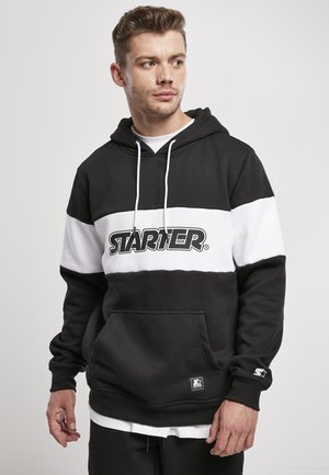 Black and white hooded sweatshirt featuring a front kangaroo pocket, ribbed cuffs, and a prominent "STARTER" logo on the chest.