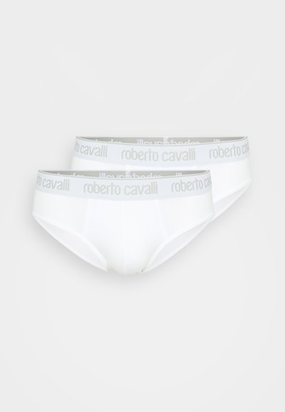 Culotte en coton blanc avec une ceinture élastique grise ornée du logo "roberto cavalli" répété. Texture lisse et design classique.