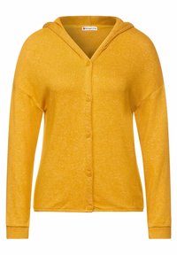 Cardigan à capuche jaune en tissu doux, avec une surface texturée, fermeture par boutons et manches longues avec bords côtelés.