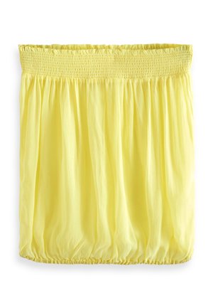 Jupe jaune clair avec taille élastique froncée et ourlet élastique, en tissu léger et fluide.