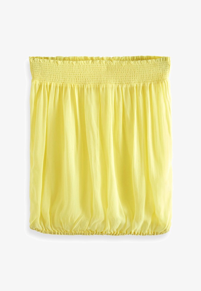 Jupe jaune clair avec taille élastique froncée et ourlet élastique, en tissu léger et fluide.