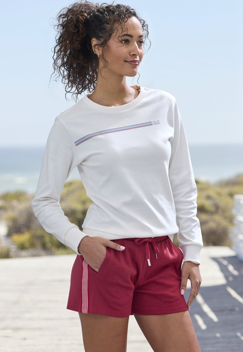 White long-sleeve top with a horizontal striped accent and maroon shorts featuring side stripes. Casual, relaxed fit with pockets.