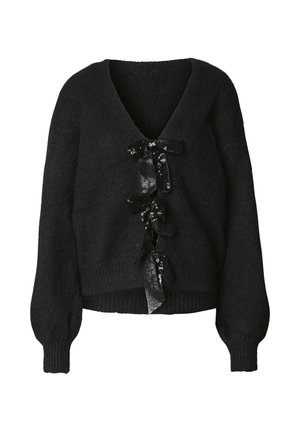 Jersey negro de punto con escote en V, que presenta un adorno central de cintas florales negras con lentejuelas y mangas voluminosas.