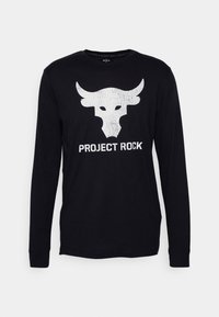 T-shirt noir à manches longues en tissu doux, arborant un logo de taureau blanc et le texte "PROJECT ROCK" imprimé en dessous.