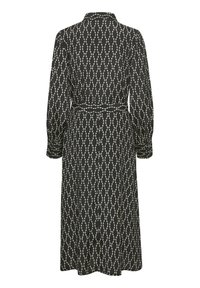 Robe midi noire à manches longues avec motif de points blancs reliés, taille cintrée par une ceinture et poignets boutonnés, vue de dos.