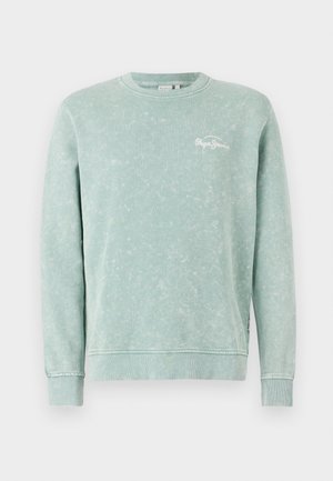 Sweatshirt vert clair en tissu doux, avec un col rond, des manches longues, des poignets côtelés et un petit logo blanc sur la poitrine.