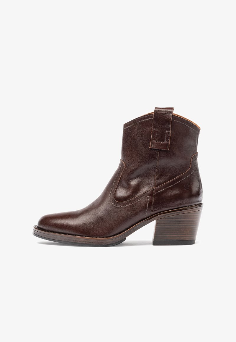 Brown leather ankle boot with a pointed toe, curved top, side cutouts, and a stacked wooden heel. Features a pull tab for easy wear.