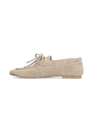 Beige suede loafer with lace tied in bow on top, side eyelets, flat sole, and low heel, shown from the outer side.