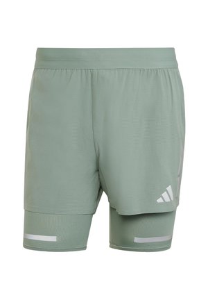 Pantalones cortos deportivos de color verde claro con un diseño de malla, banda elástica en la cintura, acentos reflectantes y un forro interior para soporte.