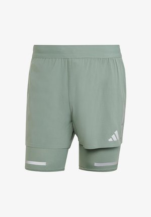 Shorts de sport vert clair avec un design en maille, une taille élastique, des accents réfléchissants et une doublure intérieure pour un soutien.