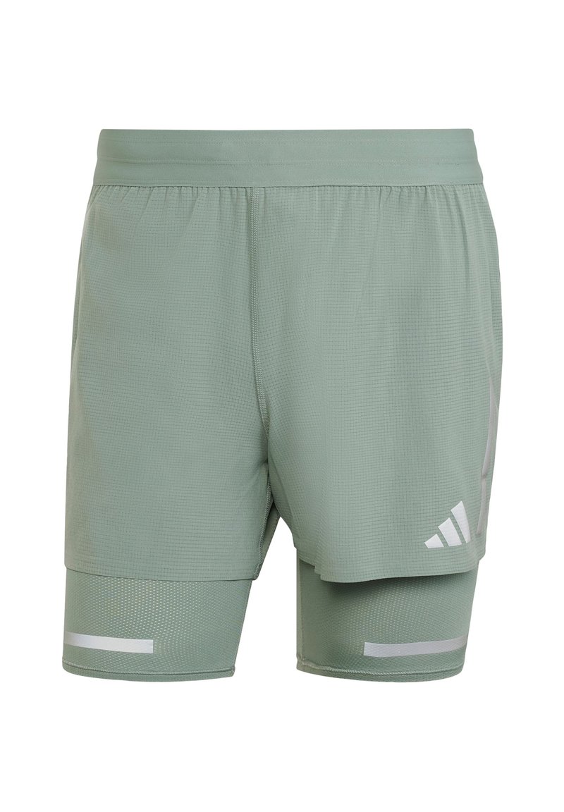 Helle grüne Sport Shorts mit einem Netzdesign, elastischem Bund, reflektierenden Akzenten und einer inneren Fütterung für zusätzlichen Halt.