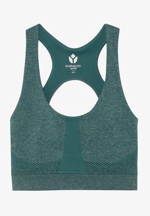 Roheline spordibrasi, mis on valmistatud tekstuuritud kangast. Omab ristiõmblusega disaini ja võrgukatte aktsente õhuringluseks. Logo asub ülemisel seljal.