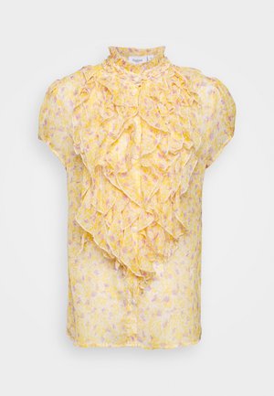 Blouse jaune à manches courtes à motif floral avec col haut à volants et volants superposés tombant sur le devant, fermeture à boutons.