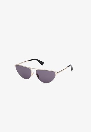 Sunglasses with a metallic gold frame, dark gray tinted lenses, and black temple tips. Angular design with a prominent brow line.
