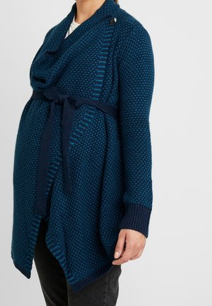 Gebreide cardigan in donker turquoise, met een sjawl kraag, lange mouwen en een strikceintuur op de taille voor een getailleerde uitstraling. Gestructureerd patroon overal.