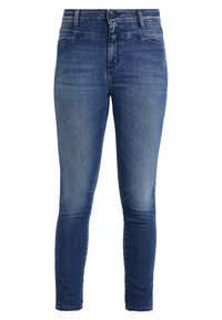 Slim fit jeans av denim i en mörkblå tvätt med blekta accenter. Har en klassisk femfickorsdesign och knappstängning.