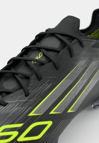 adidas Performance F50 ELITE FG - Chaussures de football pour terrain sec - core black/iron metallic/lucid lemon