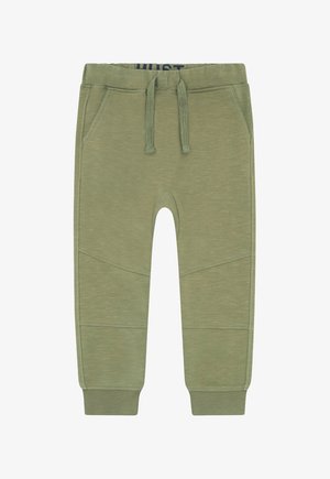 Pantaloni jogger per bambini di colore verde chiaro con vita a coulisse, tasche frontali, dettagli a pannello sul ginocchio e orli elasticizzati.