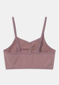 Ljust mauve-bh med tunna justerbara remmar och en samlad baksidesdesign. Tillverkad av mjukt tyg med sömlösa kanter. Ingen vaddering.