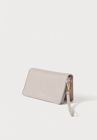 Light grey leather wallet with a textured surface, fold-over design, and a gold logo. Includes a detachable wrist strap and gold hardware.