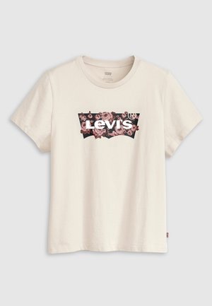 Kreemjas puuvillane t-särk ümmarguse kaelusega, millel on roosa ja must lillemuster ümber "Levi's" valge logo. Lühikesed varrukad.