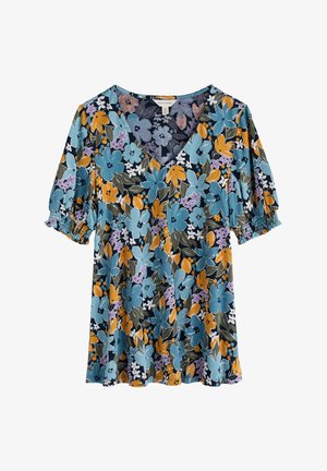 Haut floral en V teal, orné d'un mélange de fleurs bleues, jaunes et violettes sur un fond sombre. Manches courtes élastiques avec volants.