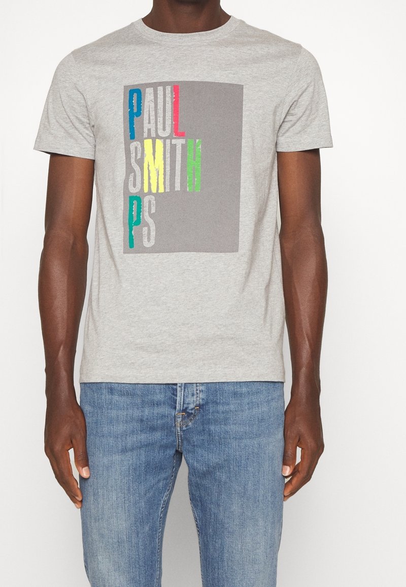 Graues Baumwoll-T-Shirt mit einem bunten Grafikdruck und dem Text "PAUL SMITH" in Blau, Rot, Gelb, Grün und Weiß auf der Vorderseite.