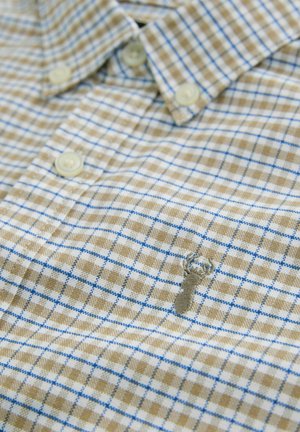 Button-up shirt featuring a light brown and blue plaid pattern, crafted from fabric with a soft texture; includes a small lobster embroidery.