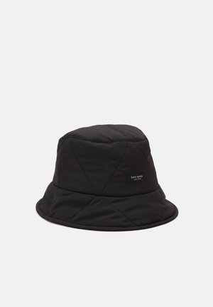 Black quilted bucket hat with a small rectangular "kate spade new york" label on the side, displayed on a plain white background.