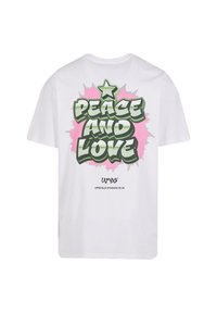 White cotton t-shirt featuring a colorful graphic print on the back with 'PEACE AND LOVE,' pink accents, and a star above the text.