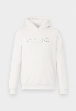 Valge kapuutsiga dressipluus, mis on valmistatud pehmest kangast. Omab känguru taskut ja embosseeritud "GUESS" logo. Varrukate ja hem on lõpetatud soonikdetailidega.