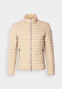 Beige puffer jacket with a high collar, horizontal quilted texture, front zipper, and side pockets. Lightweight material for comfort.