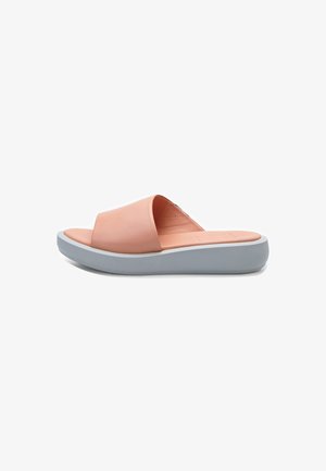 Peach-colored slide sandal with a soft leather upper; features a wide strap and a gray rubber sole for comfort and support.