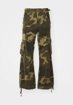 Cargo pants in a camouflage pattern featuring shades of green and brown, with multiple pockets and adjustable hems. Made from durable fabric.