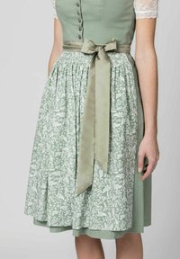 Green A-line dress with a polka dot bodice, cinched waist, and floral patterned skirt, featuring a matching satin ribbon belt.