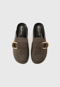 Brown patterned slip-on mules with a gold buckle accent, smooth black interior, and textured exterior, featuring a low profile design.