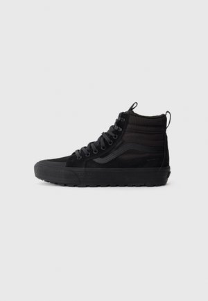 Black high-top waterproof sneaker with padded ankle, lace-up front, and textured rubber sole, shown in side profile on white background.