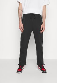Nike Sportswear TECH FLEECE OPEN HEM PANT - Träningsbyxor - black