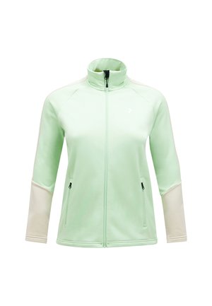 Lys grøn zip-up jakke med høj krave, kontrasterende cremede ærmer, to lynlåslommer og et lille logo på fronten. Glat stof texture.