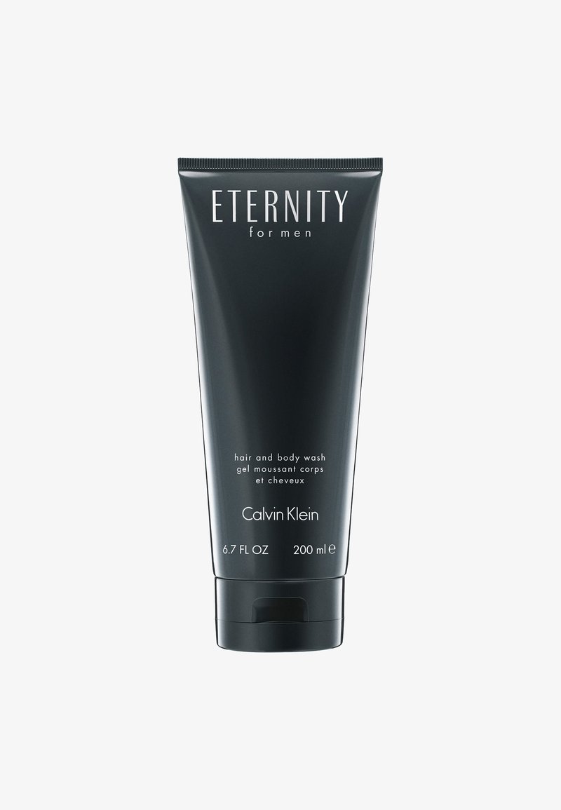 Tube en plastique noir de gel douche et shampooing pour le corps, étiqueté "Eternity for Men" par Calvin Klein. Capacité de 200 ml, avec un bouchon à rabat.