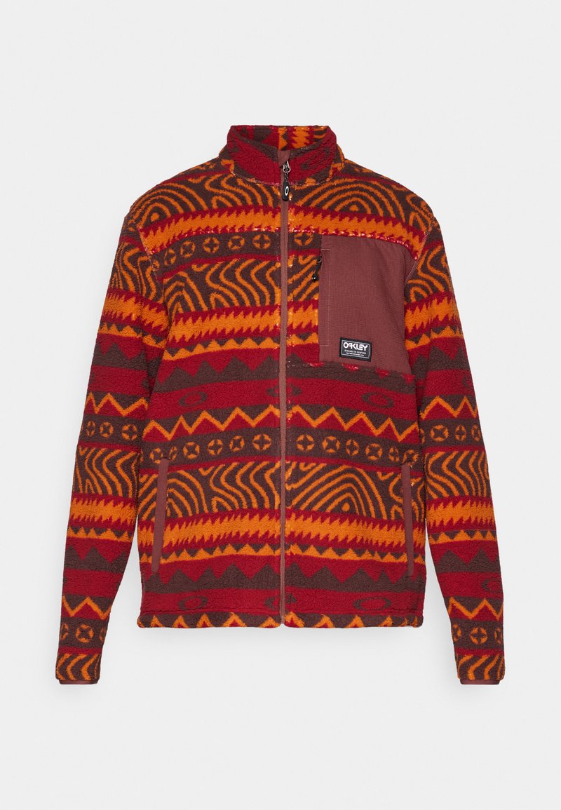Red and brown fleece jacket with geometric patterns, full zip, stand collar, and a chest pocket featuring an Oakley logo.