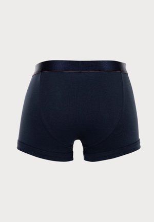 Shorts en coton bleu marine foncé, avec une ceinture élastique douce et un minimum de coutures. Présentent une texture lisse et extensible.