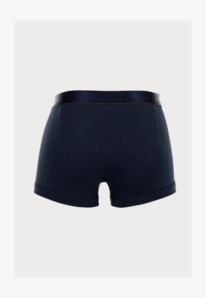 Shorts en coton bleu marine foncé, avec une ceinture élastique douce et un minimum de coutures. Présentent une texture lisse et extensible.