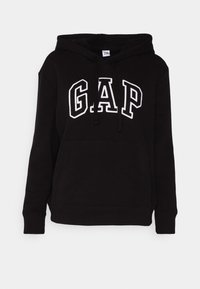 Hoodie noir en mélange de coton, avec une poche avant, une capuche à cordon de serrage, et le logo "GAP" brodé en blanc.