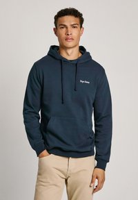 Felpa con cappuccio blu navy in cotone, dotata di tasca a marsupio e lacci, con il logo "Pepe Jeans" ricamato sul petto.