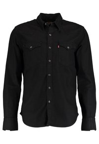 Svart långärmad skjorta i denim, med spetsig krage, två bröstfickor och knappstängning med metallackenter.