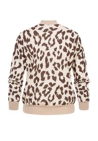 Sweat-shirt beige avec motif léopard marron foncé, col, poignets et ourlet côtelés, vu de dos.