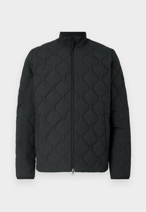 Black quilted jacket with geometric pattern, high neckline, front zipper closure, and soft fabric texture. Minimalist design without embellishments.
