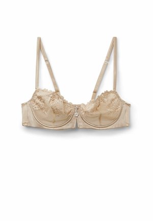 Beżowy biustonosz z fiszbinami i koronką, z regulowanymi ramiączkami oraz małym zawieszonym serduszkiem na środku z przodu.