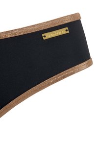 Juodas audinys bandeau su blizgiu bronzos blizgučiu. Yra auksinė metalinė prekės ženklo etiketė. Lygi tekstūra, kontūruota forma.